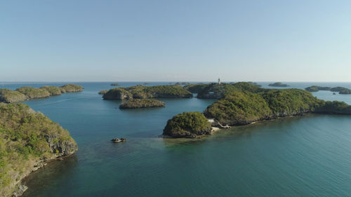 Aerial view of small islands with beaches and lagoons in hundred islands national park