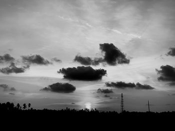 Low angle view of silhouette trees on field against sky