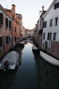 Boats moored in canal