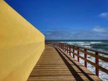 Pier over sea against sky