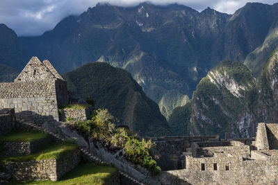 Buildings against mountain range