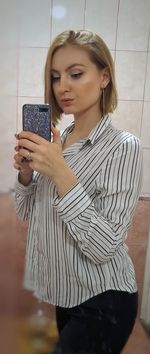 Young woman photographing with mobile phone