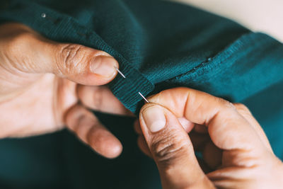 Cropped hand of woman holding hands