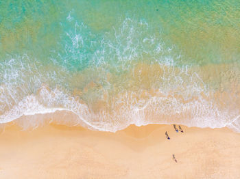 Aerial view of people enjoying on beach