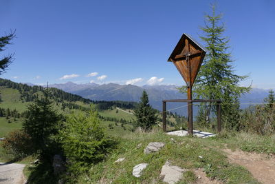 Traditional windmill on field against sky