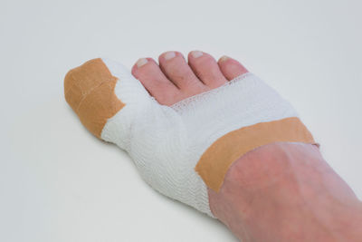 Close-up of human hand against white background