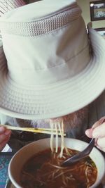 Close-up of hand holding tea cup