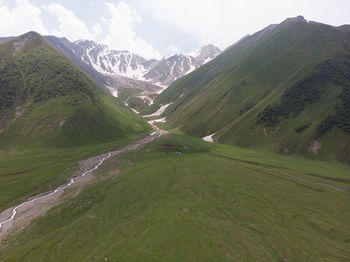 Scenic view of landscape and mountains against sky