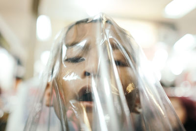 Close-up of boy face covered with plastic