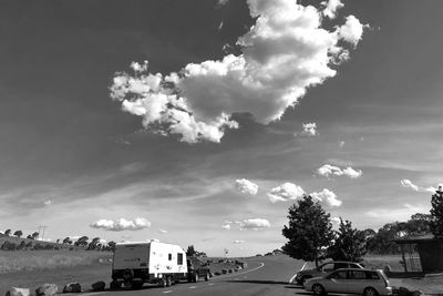 Cars on road against sky