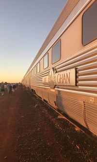 Train on railroad tracks against clear sky