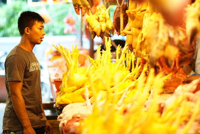 Midsection of man for sale in market