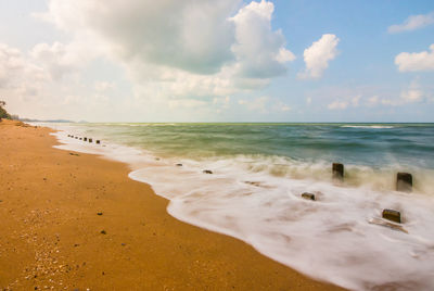 Scenic view of beach against sky