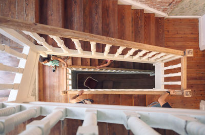 Directly above shot of people walking on steps in building