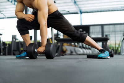 Low section of man exercising in gym