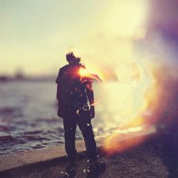 Double exposure of man with cloudy sky