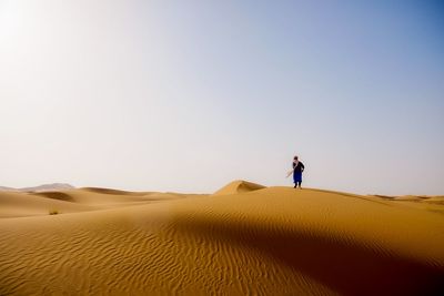 Scenic view of desert against clear sky