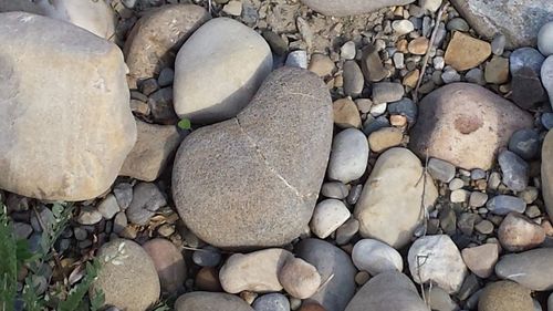 High angle view of stones on pebbles