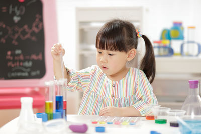 Portrait of a girl looking at table