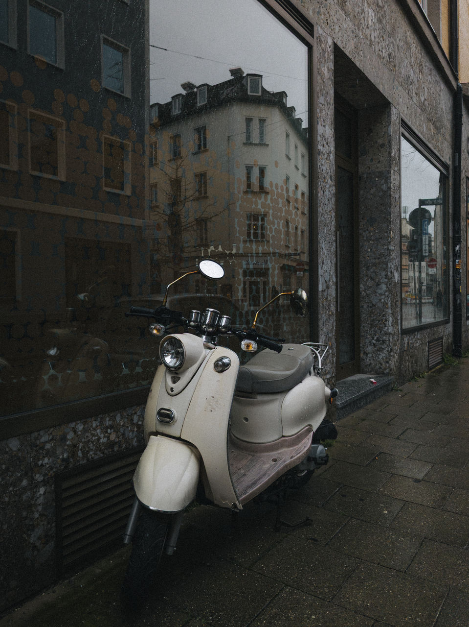 scooter, architecture, built structure, building exterior, city, vespa, mode of transportation, transportation, street, vehicle, building, no people, screenshot, day