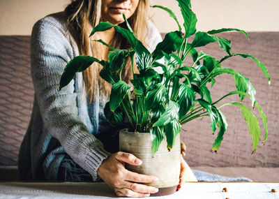 Woman sitting in pot