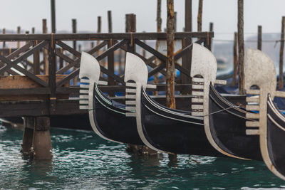 Close-up of boats moored in sea