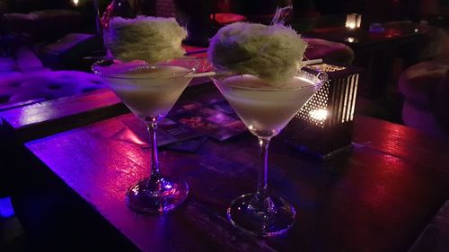 Close-up of wine glasses on table