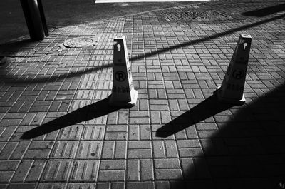 High angle view of shadow on footpath