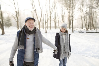 Happy senior couple ice skating