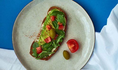 High angle view of vegetables in plate on table