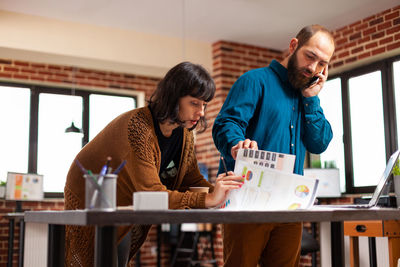 Side view of man working at office