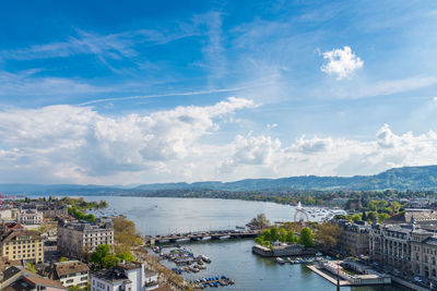 High angle view of city against cloudy sky