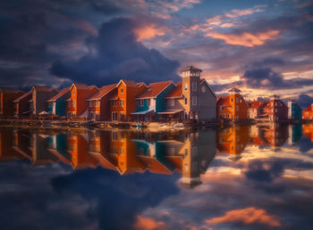 Scenic view of buildings against sky during sunset