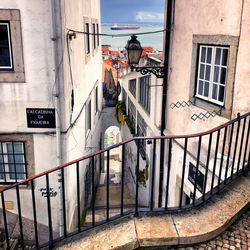 Footpath by building in city