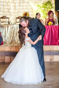 Father with daughter dancing in wedding ceremony
