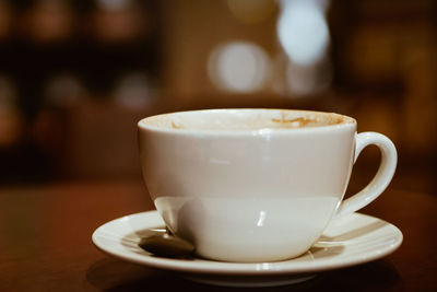 Close-up of coffee cup on table