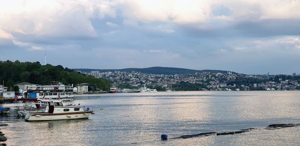 Scenic view of sea by city against sky