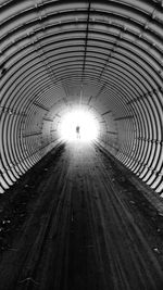 People walking in tunnel