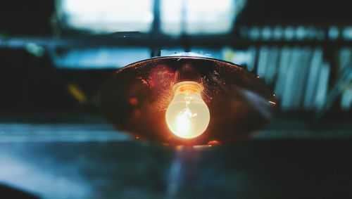 Close-up of illuminated light bulb