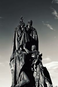 Low angle view of statue against sky