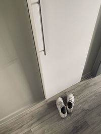 High angle view of shoes on hardwood floor