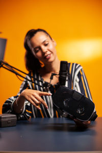 Portrait of young woman using mobile phone