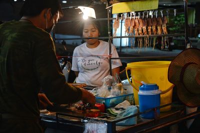 People at market stall