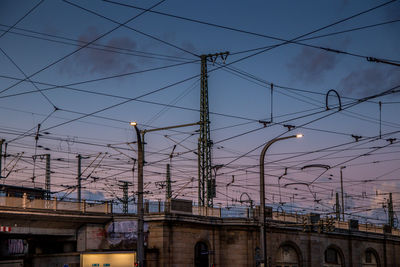 Low angle view of street lights against sky