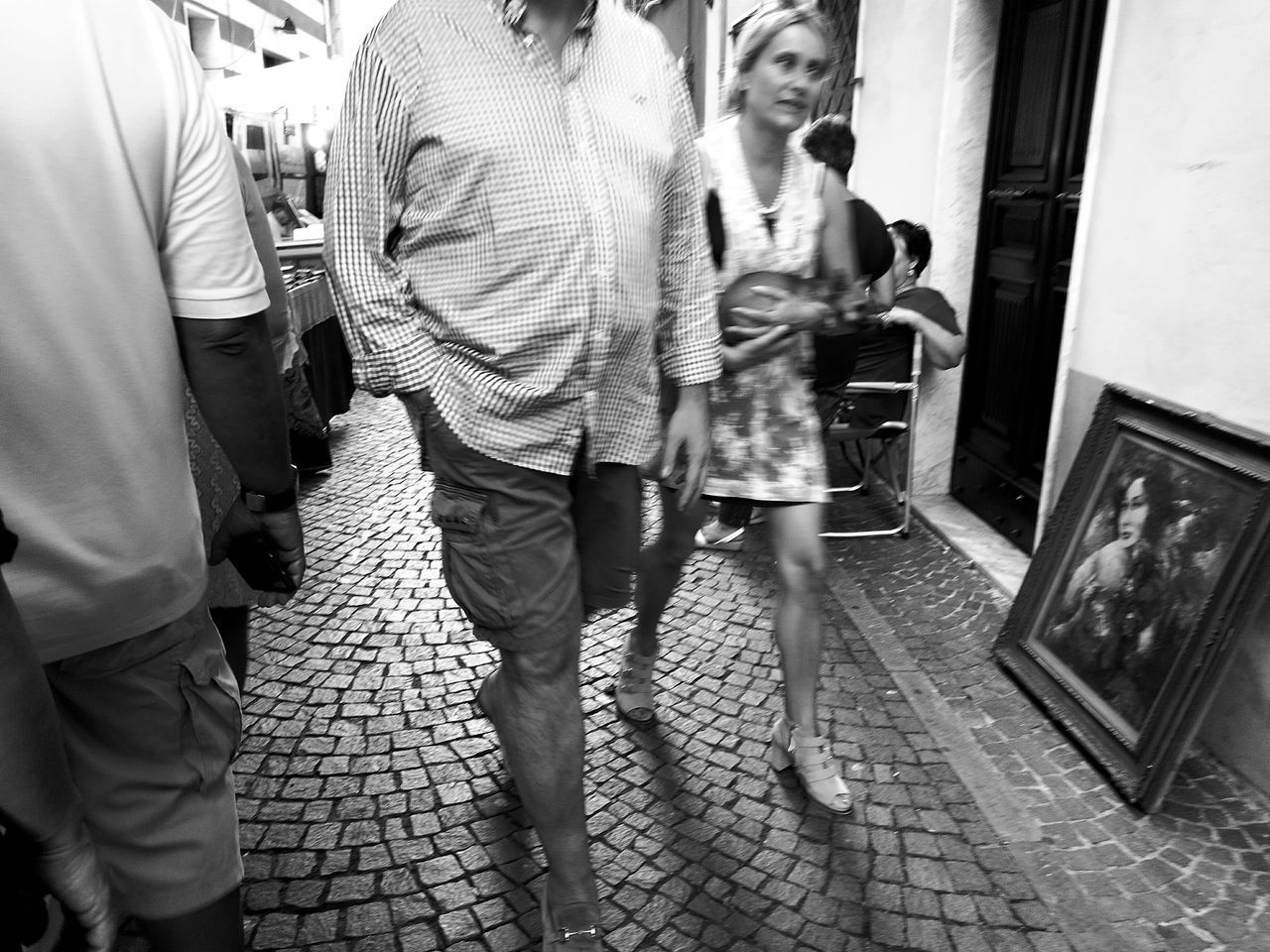 WOMAN STANDING ON SIDEWALK