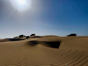 Scenic view of desert against clear sky
