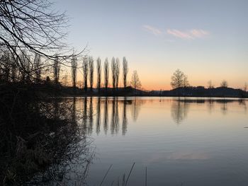 Scenic view of lake against sky during sunset