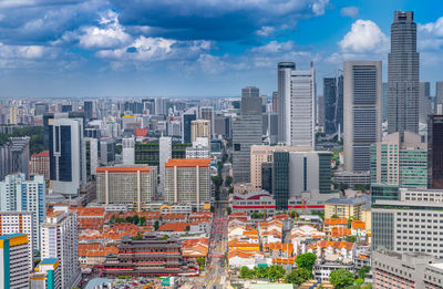 High view of singapore skyline with skyscrapers and tooth relic temple