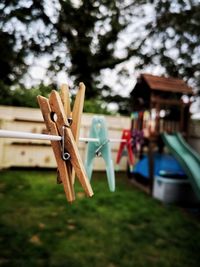 Close-up of clothespins on clothesline