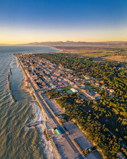 High angle view of land against sky during sunset